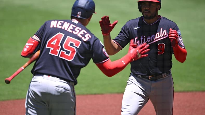 Jun 25, 2023; San Diego, California, USA; Washington Nationals third baseman Jeimer Candelario (9) is congratulated by designated hitter Joey Meneses (45) after hitting a home run against the San Diego Padres during the first inning at Petco Park. Mandatory Credit: Orlando Ramirez-USA TODAY Sports