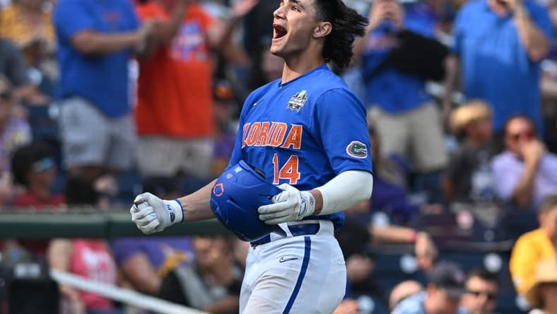 Jun 25, 2023; Omaha, NE, USA; Florida Gators first baseman Jac Caglianone (14) celebrates hitting a home run against the LSU Tigers in the eighth inning at Charles Schwab Field Omaha. Mandatory Credit: Steven Branscombe-USA TODAY Sports