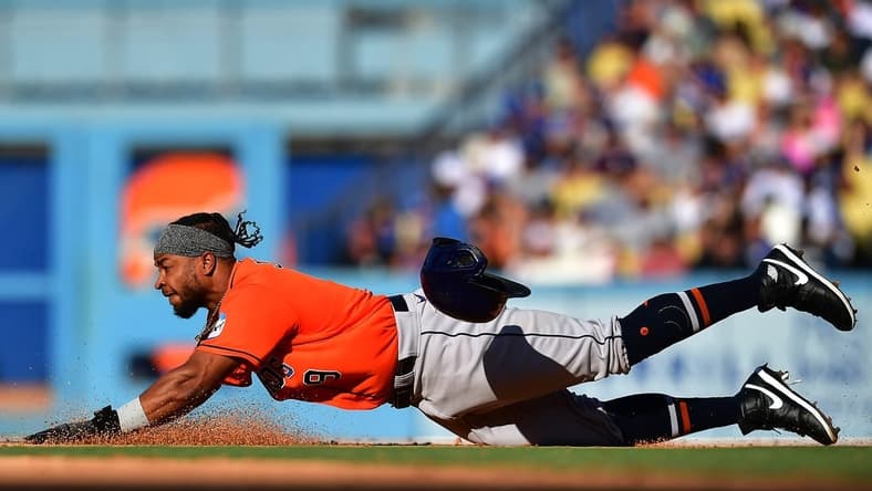 Jun 25, 2023; Los Angeles, California, USA; Houston Astros designated hitter Corey Julks (9) steals second against the Los Angeles Dodgers during the seventh inning at Dodger Stadium. Mandatory Credit: Gary A. Vasquez-USA TODAY Sports