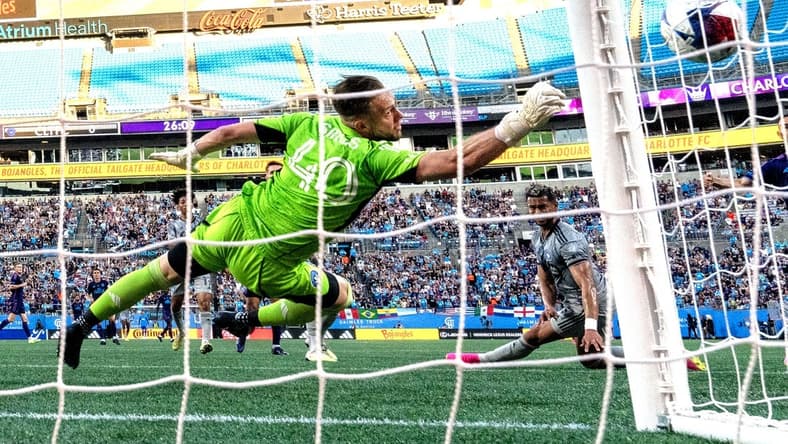 Jun 24, 2023; Charlotte, North Carolina, USA;  CF Montr  al goalkeeper Jonathan Sirois (40) deflects the ball in the first half at Bank of America Stadium. Mandatory Credit: Bob Donnan-USA TODAY Sports