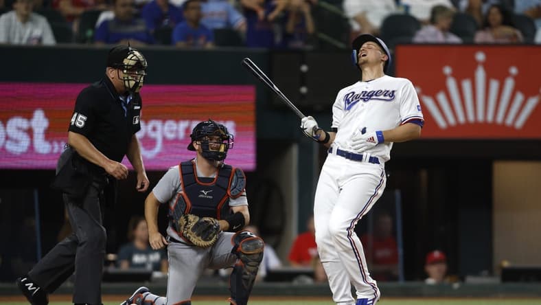 Jun 26, 2023; Arlington, Texas, USA; Texas Rangers shortstop Corey Seager (5) reacts after being hit by a pitch in the fifth inning against the Detroit Tigers at Globe Life Field. Mandatory Credit: Tim Heitman-USA TODAY Sports