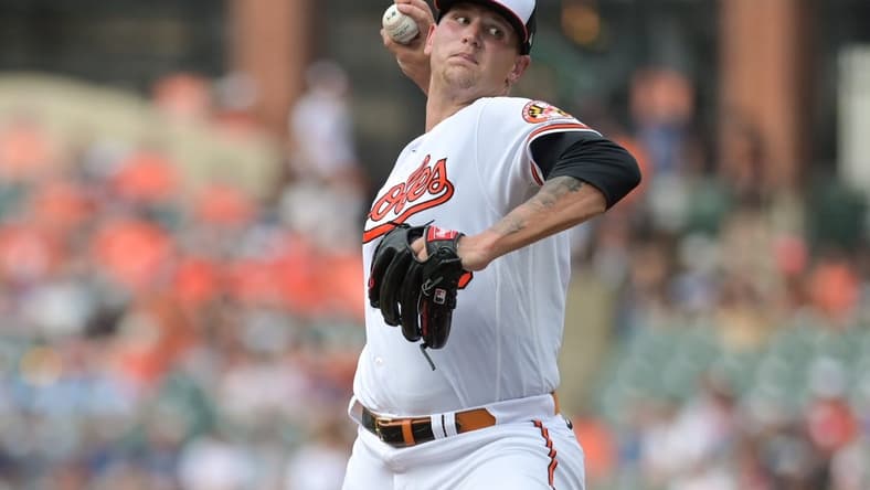 Jun 27, 2023; Baltimore, Maryland, USA; Baltimore Orioles starting pitcher Tyler Wells (68) throws a first inning pitch against the Cincinnati Reds at Oriole Park at Camden Yards. Mandatory Credit: Tommy Gilligan-USA TODAY Sports