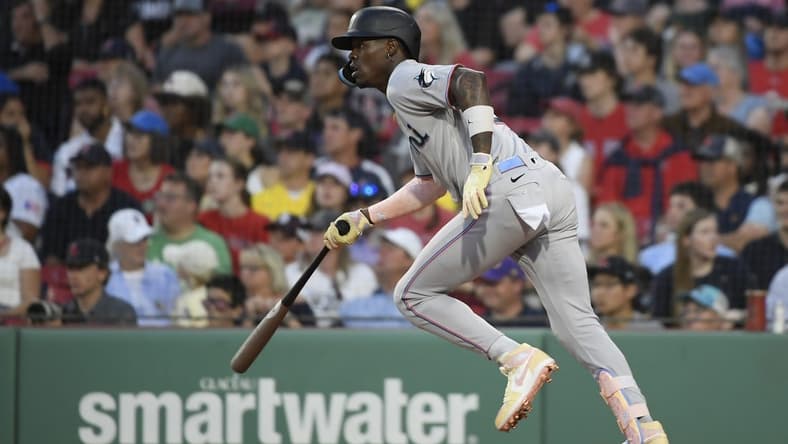 Jun 27, 2023; Boston, Massachusetts, USA; Miami Marlins center fielder Jazz Chisholm (2) hits an RBI single during the fourth inning against the Boston Red Sox at Fenway Park. Mandatory Credit: Bob DeChiara-USA TODAY Sports