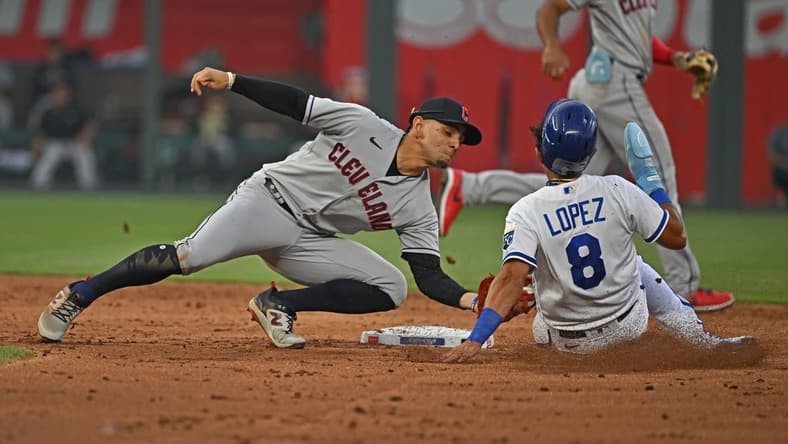 Jun 27, 2023; Kansas City, Missouri, USA; Cleveland Guardians second baseman Andres Gimenez (0) tags out Kansas City Royals Nicky Lopez (8) attempting to steal second base in the third inning at Kauffman Stadium. Mandatory Credit: Peter Aiken-USA TODAY Sports