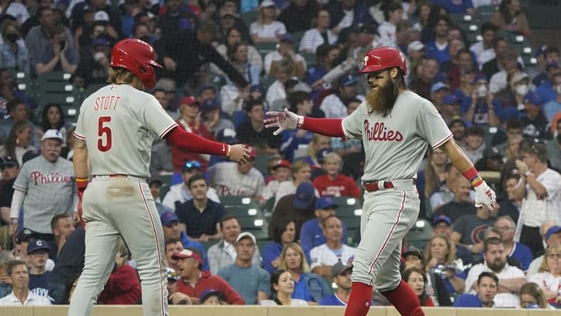 Jun 27, 2023; Chicago, Illinois, USA; Philadelphia Phillies center fielder Brandon Marsh (16) is greeted by second baseman Bryson Stott (5) after hitting a two-run homer against the Chicago Cubs during the fifth inning at Wrigley Field. Mandatory Credit: David Banks-USA TODAY Sports
