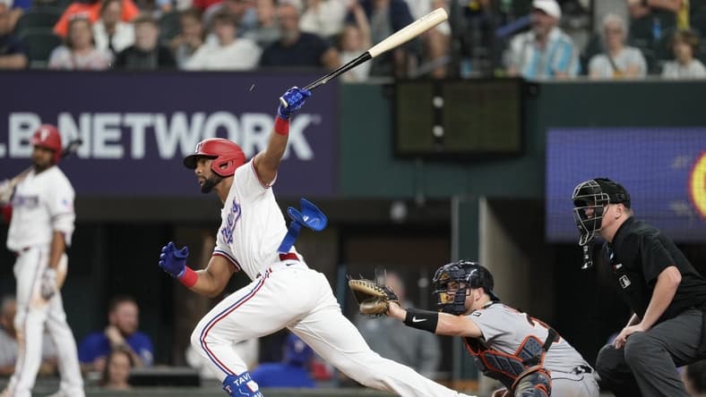 Jun 27, 2023; Arlington, Texas, USA; Texas Rangers pinch hitter Leody Taveras (3) follows through on his RBI single against the Detroit Tigers during the sixth inning at Globe Life Field. Mandatory Credit: Jim Cowsert-USA TODAY Sports