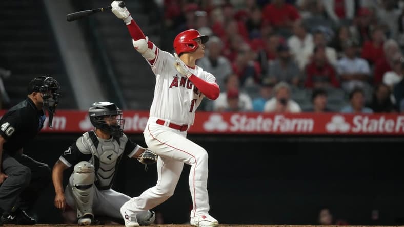 Jun 27, 2023; Anaheim, California, USA; Los Angeles Angels starting pitcher Shohei Ohtani (17) follows through on a home run in the seventh inning against the Chicago White Sox at Angel Stadium. Mandatory Credit: Kirby Lee-USA TODAY Sports