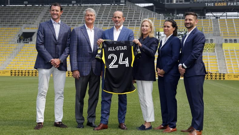 Jun 28, 2023; Columbus, OH, USA; (from left to right) Haslam Group Partner J.W. Johnson, Crew Owner Dr. Peter Edwards, Major League Soccer Commissioner Don Garber, Crew Owner Dee Haslam, Crew President of Business Operations Kristin Bernert, Crew President and General Manager Tim Bezbatchenko, on the pitch during the 2024 MLS All-Star Host City and Stadium Announcement ceremonies at Lower.com Field. Mandatory Credit: Joseph Maiorana-USA TODAY Sports