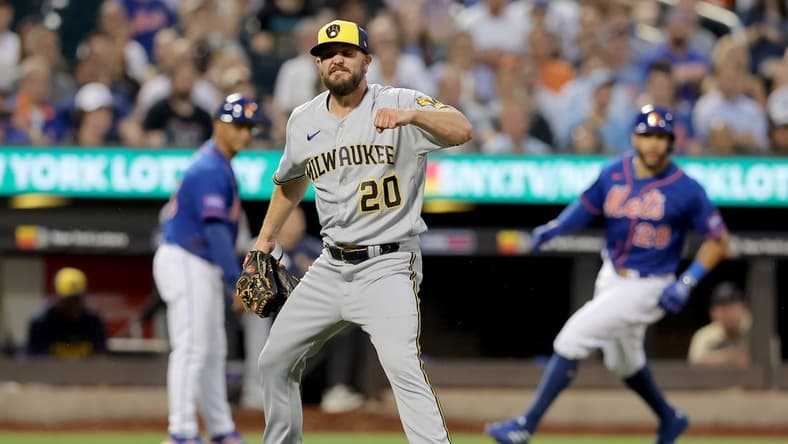 Jun 28, 2023; New York City, New York, USA; Milwaukee Brewers starting pitcher Wade Miley (20) reacts after inducing an inning ending double play during the fourth inning against the New York Mets at Citi Field. Mandatory Credit: Brad Penner-USA TODAY Sports