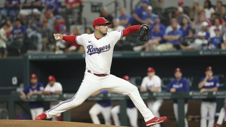 Jun 28, 2023; Arlington, Texas, USA; Texas Rangers starting pitcher Dane Dunning (33) throws during the first inning against the Detroit Tigers at Globe Life Field. Mandatory Credit: Kevin Jairaj-USA TODAY Sports