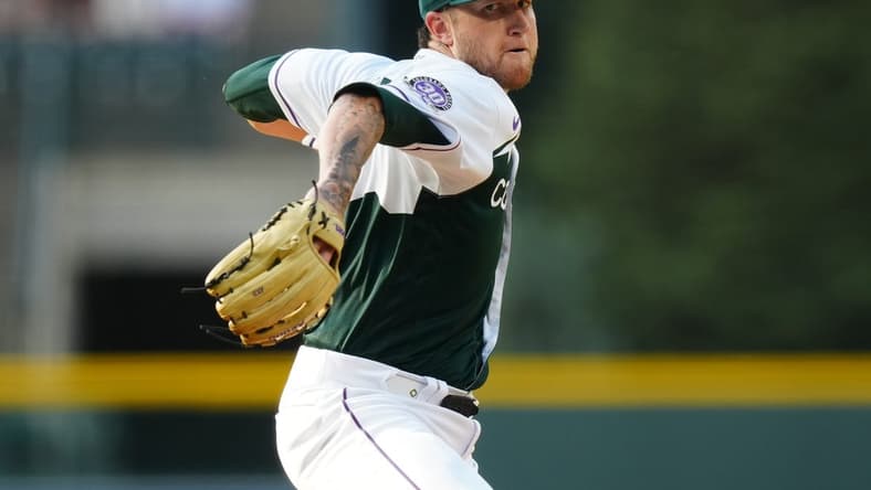 Jun 28, 2023; Denver, Colorado, USA; Colorado Rockies starting pitcher Kyle Freeland (21) delivers a pitch in the first inning against the Los Angeles Dodgers at Coors Field. Mandatory Credit: Ron Chenoy-USA TODAY Sports