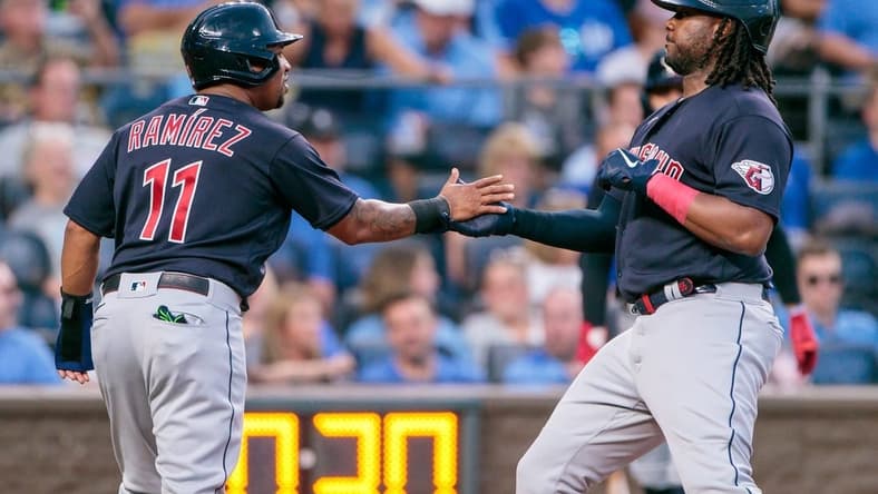 Jun 28, 2023; Kansas City, Missouri, USA; Cleveland Guardians designated hitter Josh Bell (55) slaps hands with third baseman Jose Ramirez (11) after hitting a home run during the fifth inning against the Kansas City Royals at Kauffman Stadium. Mandatory Credit: William Purnell-USA TODAY Sports