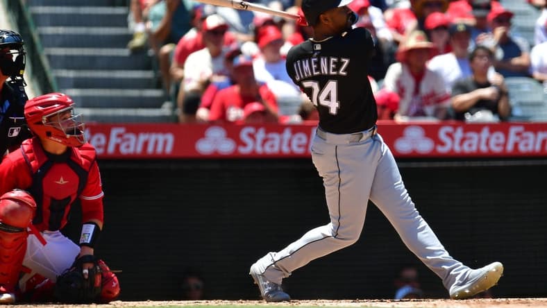 Jun 29, 2023; Anaheim, California, USA; Chicago White Sox right fielder Eloy Jimenez (74) hits a two run RBI single against the Los Angeles Angels during the third inning at Angel Stadium. Mandatory Credit: Gary A. Vasquez-USA TODAY Sports