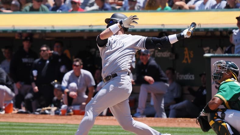 Jun 29, 2023; Oakland, California, USA; New York Yankees third baseman Josh Donaldson (28) hits a two-run home run against the Oakland Athletics during the sixth inning at Oakland-Alameda County Coliseum. Mandatory Credit: Kelley L Cox-USA TODAY Sports
