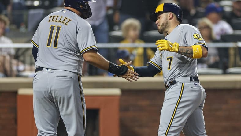 Jun 29, 2023; New York City, New York, USA; Milwaukee Brewers catcher Victor Caratini (7) slaps hands with first baseman Rowdy Tellez (11) after his two run home run against the New York Mets during the sixth inning at Citi Field. Mandatory Credit: Vincent Carchietta-USA TODAY Sports
