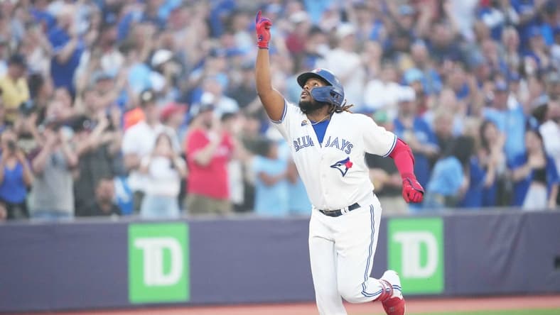 Jun 29, 2023; Toronto, Ontario, CAN; Toronto Blue Jays designated hitter Vladimir Guerrero Jr. (27) celebrates as he runs the bases after hitting a two run home run against the San Francisco Giants during the sixth inning at Rogers Centre. Mandatory Credit: Nick Turchiaro-USA TODAY Sports