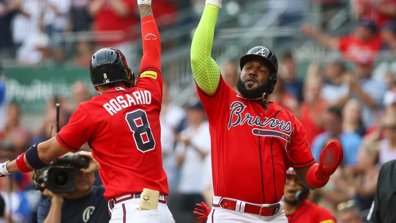 Jun 30, 2023; Atlanta, Georgia, USA; Atlanta Braves left fielder Eddie Rosario (8) celebrates after a home run with designated hitter Marcell Ozuna (20) against the Miami Marlins in the first inning at Truist Park. Mandatory Credit: Brett Davis-USA TODAY Sports