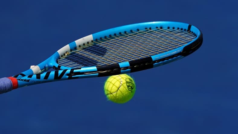 Aug 15, 2019; Mason, OH, USA; A view of the Western and Southern Open tennis ball on the racquet of Rebecca Peterson (SWE) as she prepares to serve against Karolina Pliskova (CZE) during the Western and Southern Open tennis tournament at Lindner Family Tennis Center. Mandatory Credit: Aaron Doster-USA TODAY Sports