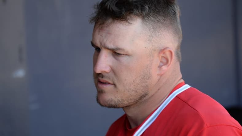 Mar 21, 2021; Peoria, Arizona, USA; Los Angeles Angels center fielder Mike Trout (27) looks on against the San Diego Padres during the fifth inning of a spring training game at Peoria Sports Complex. Mandatory Credit: Joe Camporeale-USA TODAY Sports