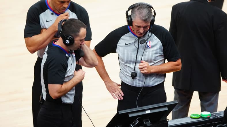 Jun 22, 2021; Phoenix, Arizona, USA; NBA referee Scott Foster (right) with Kane Fitzgerald and Curtis Blair during a video review in the Phoenix Suns against the Los Angeles Clippers during game two of the Western Conference Finals for the 2021 NBA Playoffs at Phoenix Suns Arena. Mandatory Credit: Mark J. Rebilas-USA TODAY Sports