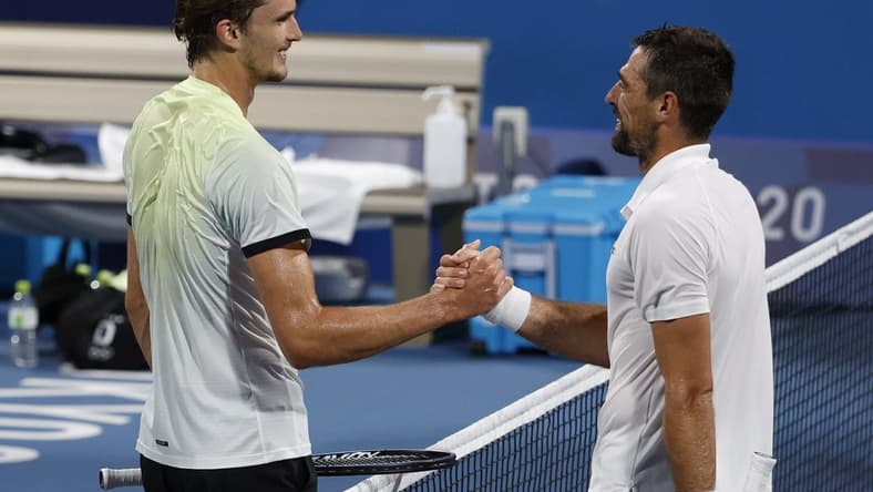 Jul 29, 2021; Tokyo, Japan; Alexander Zverev of Germany (L) shakes hands with Jeremy Chardy of France (R) after their match in a men's singles quarterfinal during the Tokyo 2020 Olympic Summer Games at Ariake Tennis Park. Mandatory Credit: Geoff Burke-USA TODAY Sports