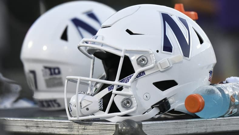 Sep 18, 2021; Durham, North Carolina, USA; A Northwestern Wildcats helmet sits on an equipment chest during the fourth quarter at Wallace Wade Stadium. Mandatory Credit: William Howard-USA TODAY Sports