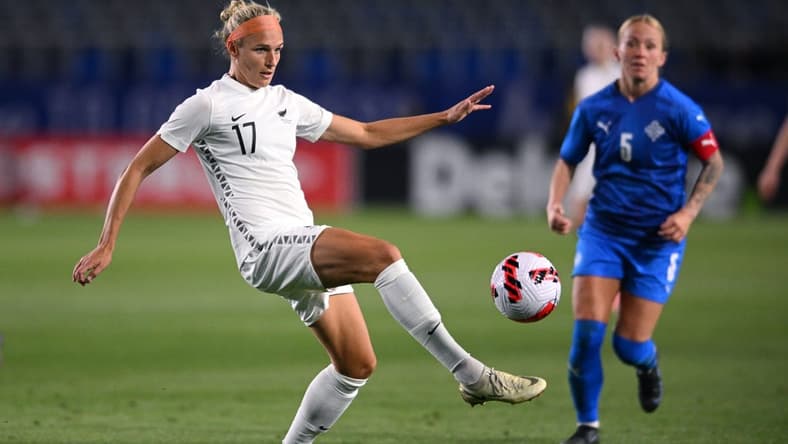 Feb 17, 2022; Carson, California, USA; New Zealand forward Hannah Wilkinson (17) passes the ball ahead of Iceland midfielder Gunnhildur Yrsa Jonsdottir (5) in the second half during a 2022 SheBelieves Cup international soccer match at Dignity Health Sports Park. Mandatory Credit: Orlando Ramirez-USA TODAY Sports