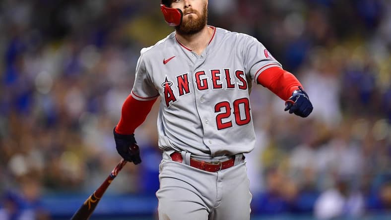 Jun 14, 2022; Los Angeles, California, USA; Los Angeles Angels first baseman Jared Walsh (20) reacts after striking out with bases loaded against the Los Angeles Dodgers during the ninth inning at Dodger Stadium. Mandatory Credit: Gary A. Vasquez-USA TODAY Sports