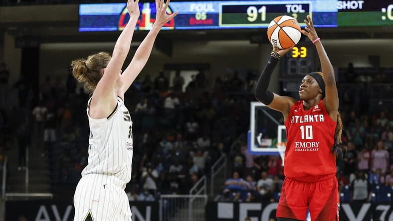 Jun 17, 2022; Chicago, Illinois, USA; Atlanta Dream guard Rhyne Howard (10) shoots against Chicago Sky forward Emma Meesseman (33) during the second half of a WNBA game at Wintrust Arena. Mandatory Credit: Kamil Krzaczynski-USA TODAY Sports