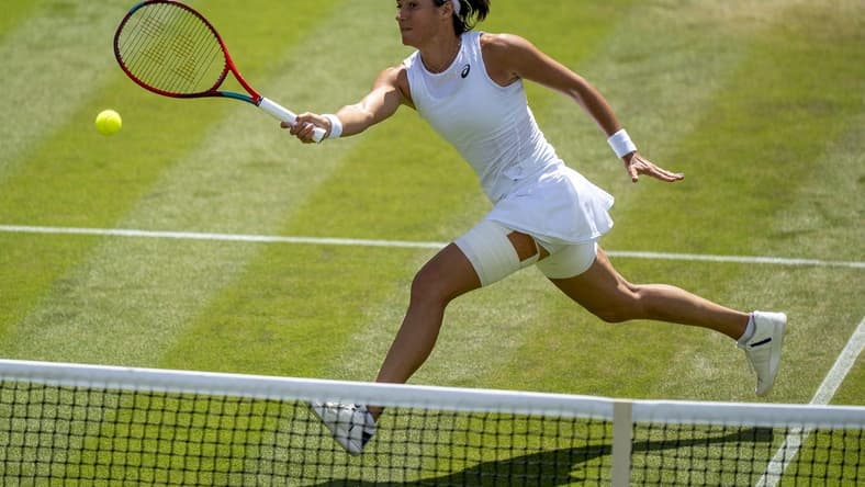 Jul 3, 2022; London, United Kingdom; Caroline Garcia (FRA) returns a shot during her match against Marie Bouzkova (CZE) on day seven at All England Lawn Tennis and Croquet Club. Mandatory Credit: Susan Mullane-USA TODAY Sports