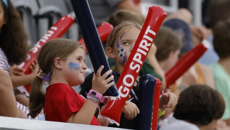 Jul 17, 2022; Washington, District of Columbia, USA; A young Washington Spirit fan cheers from the stand during the second half against Orlando Pride at Audi Field. Mandatory Credit: Geoff Burke-USA TODAY Sports