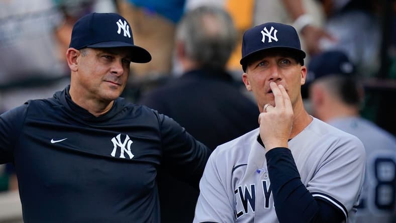 Jul 22, 2022; Baltimore, Maryland, USA; New York Yankees hitting coach Dillon Lawson (74) stands with manager Aaron Boone (17) before the game against the Baltimore Orioles at Oriole Park at Camden Yards. Mandatory Credit: Tommy Gilligan-USA TODAY Sports