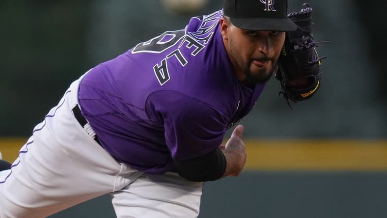 Aug 12, 2022; Denver, Colorado, USA; Colorado Rockies starting pitcher Antonio Senzatela (49) delivers a pitch against the Arizona Diamondbacks n the first inning at Coors Field. Mandatory Credit: Ron Chenoy-USA TODAY Sports