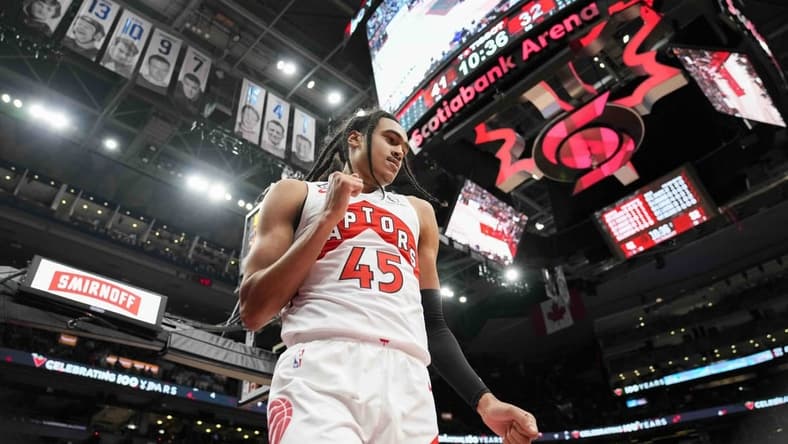 Oct 9, 2022; Toronto, Ontario, CAN; Toronto Raptors guard Dalano Banton (45) celebrates after scoring against the Chicago Bulls at Scotiabank Arena. Mandatory Credit: Kevin Sousa-USA TODAY Sports
