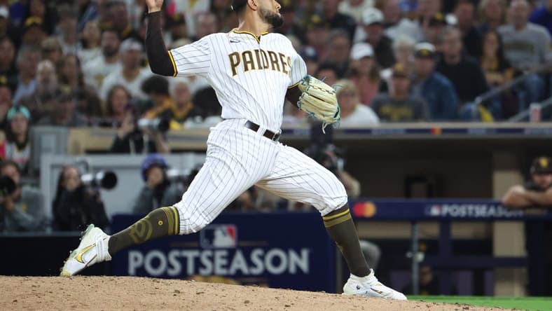 Oct 14, 2022; San Diego, California, USA; San Diego Padres relief pitcher Robert Suarez (75) throws a pitch in the eighth inning against the Los Angeles Dodgers during game three of the NLDS for the 2022 MLB Playoffs at Petco Park. Mandatory Credit: Kiyoshi Mio-USA TODAY Sports