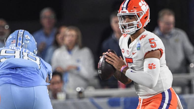 Clemson quarterback DJ Uiagalelei (5) fades back to pass near North Carolina defensive lineman Kevin Hester (98) during the first quarter of the ACC Championship football game at Bank of America Stadium in Charlotte, North Carolina Saturday, Dec 3, 2022.
Clemson Tigers Football Vs North Carolina Tar Heels Acc Championship Charlotte Nc