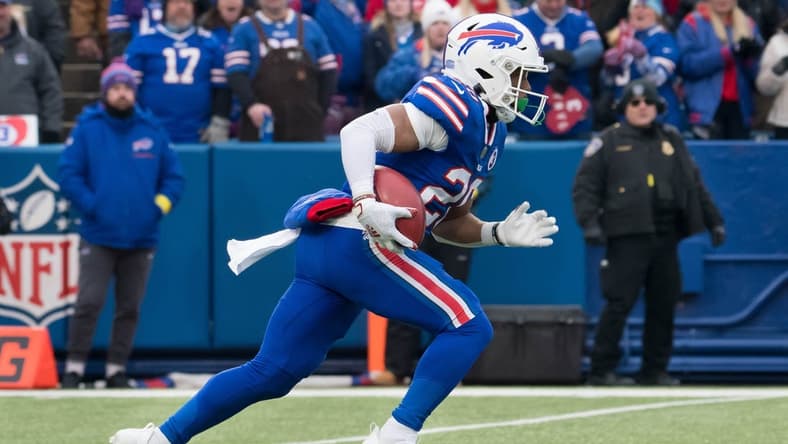 Jan 8, 2023; Orchard Park, New York, USA; Buffalo Bills running back Nyheim Hines (20) returns a kickoff to score a touchdown on the opening play of a game against the New England Patriots at Highmark Stadium. Mandatory Credit: Mark Konezny-USA TODAY Sports