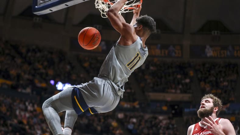 Feb 4, 2023; Morgantown, West Virginia, USA; West Virginia Mountaineers forward Mohamed Wague (11) dunks the ball during the second half against the Oklahoma Sooners at WVU Coliseum. Mandatory Credit: Ben Queen-USA TODAY Sports