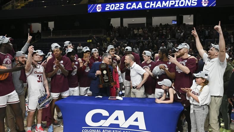 Mar 7, 2023; Washington, D.C., USA; Colonial Athletic Association commissioner Joe D'Antonio presents Charleston Cougars head coach Pat Kelsey the conference championship trophy after defeating North Carolina-Wilmington Seahawks at Entertainment & Sports Arena. Mandatory Credit: Tommy Gilligan-USA TODAY Sports