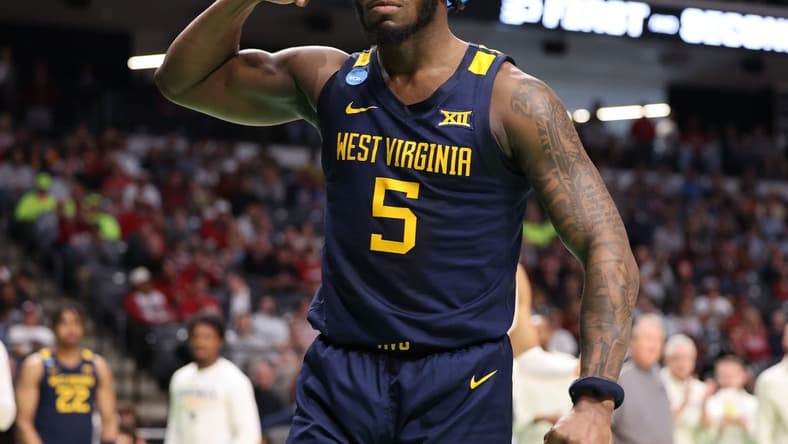 Mar 16, 2023; Birmingham, AL, USA; West Virginia Mountaineers guard Joe Toussaint (5) reacts after a basket while being fouled against the Maryland Terrapins during the second half in the first round of the 2023 NCAA Tournament at Legacy Arena. Mandatory Credit: Vasha Hunt-USA TODAY Sports