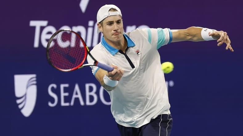 Mar 22, 2023; Miami, Florida, US; John Isner (USA) hits a forehand against Emilio Nara (USA) (not pictured) on day three of the Miami Open at Hard Rock Stadium. Mandatory Credit: Geoff Burke-USA TODAY Sports