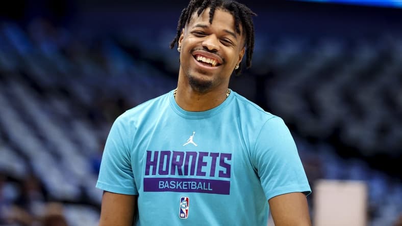 Mar 24, 2023; Dallas, Texas, USA; Charlotte Hornets guard Dennis Smith Jr. (8) laughs before the game against the Dallas Mavericks at American Airlines Center. Mandatory Credit: Kevin Jairaj-USA TODAY Sports