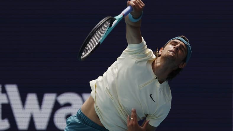 Mar 25, 2023; Miami, Florida, US; Lorenzo Musetti (ITA) serves against Jiri Lehechka (CZE) (not pictured) on day six of the Miami Open at Hard Rock Stadium. Mandatory Credit: Geoff Burke-USA TODAY Sports
