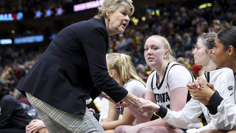 Apr 2, 2023; Dallas, TX, USA; Iowa Hawkeyes head coach Lisa Bluder talks to players on her bench in the game against the LSU Lady Tigers in the second half during the final round of the Women's Final Four NCAA tournament at the American Airlines Center. Mandatory Credit: Kevin Jairaj-USA TODAY Sports