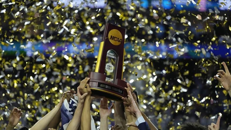 Apr 3, 2023; Houston, TX, USA; Connecticut Huskies players celebrate after defeating the San Diego State Aztecs in the national championship game of the 2023 NCAA Tournament at NRG Stadium. Mandatory Credit: Bob Donnan-USA TODAY Sports
