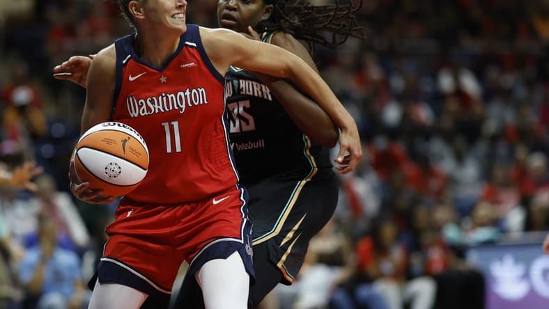 May 19, 2023; Washington, District of Columbia, USA; Washington Mystics forward Elena Delle Donne (11) drives to the basket as New York Liberty forward Jonquel Jones (35) defends in the third quarter at Entertainment & Sports Arena. Mandatory Credit: Geoff Burke-USA TODAY Sports