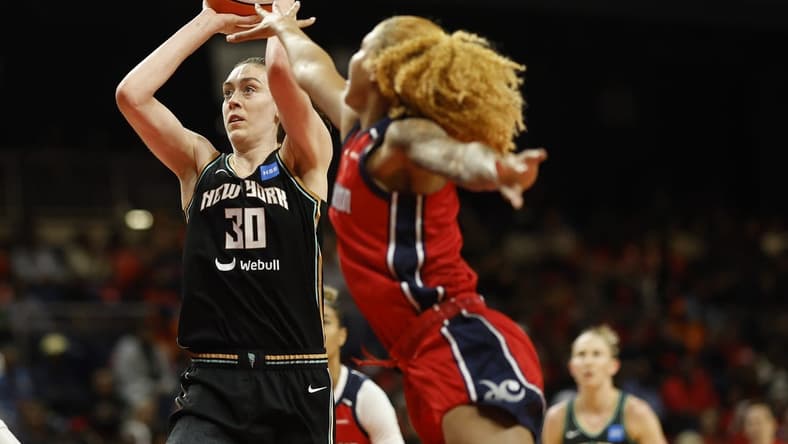 May 19, 2023; Washington, District of Columbia, USA; New York Liberty forward Breanna Stewart (30) shoots the ball as Washington Mystics center Shakira Austin (0) defends at Entertainment & Sports Arena. Mandatory Credit: Geoff Burke-USA TODAY Sports