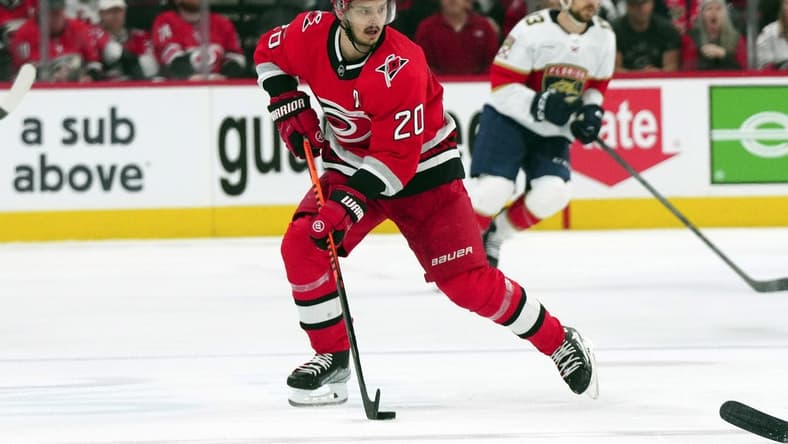 May 20, 2023; Raleigh, North Carolina, USA; Carolina Hurricanes center Sebastian Aho (20) pushes the puck up the ice against the Florida Panthers in game two of the Eastern Conference Finals of the 2023 Stanley Cup Playoffs at PNC Arena. Mandatory Credit: James Guillory-USA TODAY Sports