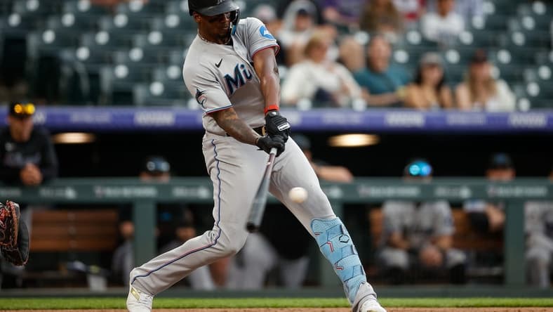 May 25, 2023; Denver, Colorado, USA; Miami Marlins designated hitter Jorge Soler (12) hits a two run home run in the ninth inning against the Colorado Rockies at Coors Field. Mandatory Credit: Isaiah J. Downing-USA TODAY Sports