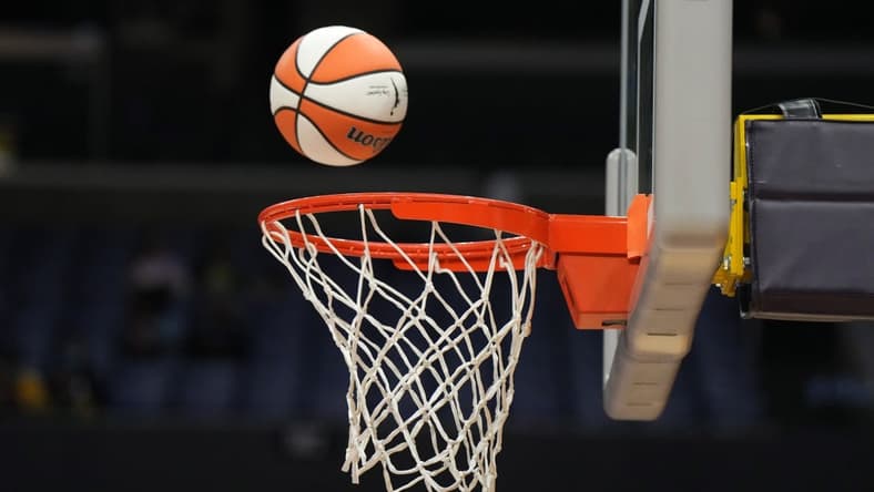 May 25, 2023; Los Angeles, California, USA; Wilson official basketball with WNBA logo goes through the net during the game between the LA Sparks and the Las Vegas Aces at Crypto.com Arena. Mandatory Credit: Kirby Lee-USA TODAY Sports